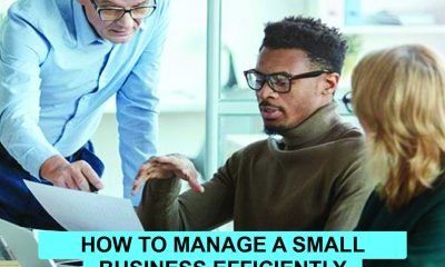 Focused small business owner using laptop, charts, and tools to manage operations efficiently with smart strategies and technology.