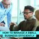 Focused small business owner using laptop, charts, and tools to manage operations efficiently with smart strategies and technology.