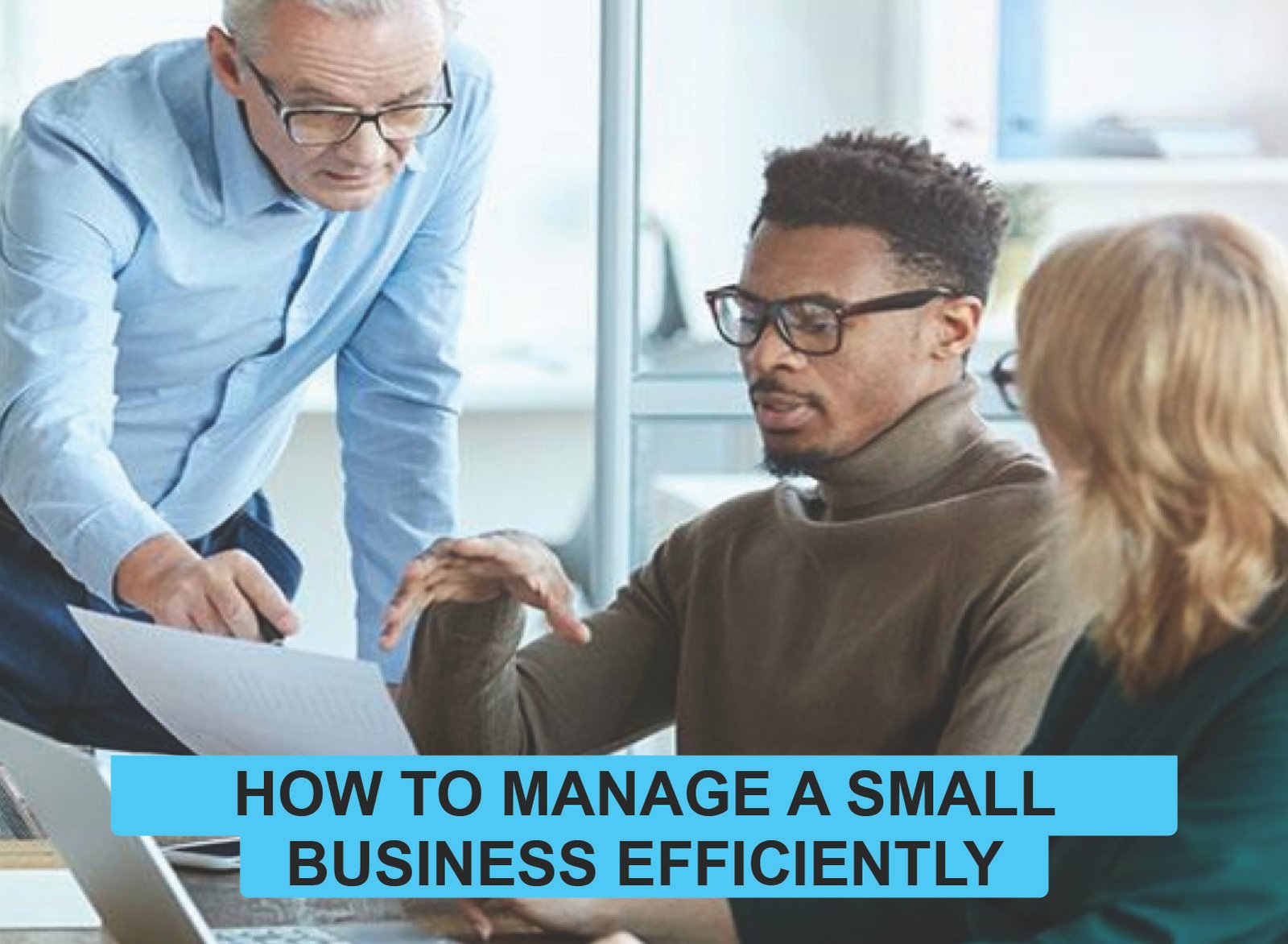 Focused small business owner using laptop, charts, and tools to manage operations efficiently with smart strategies and technology.